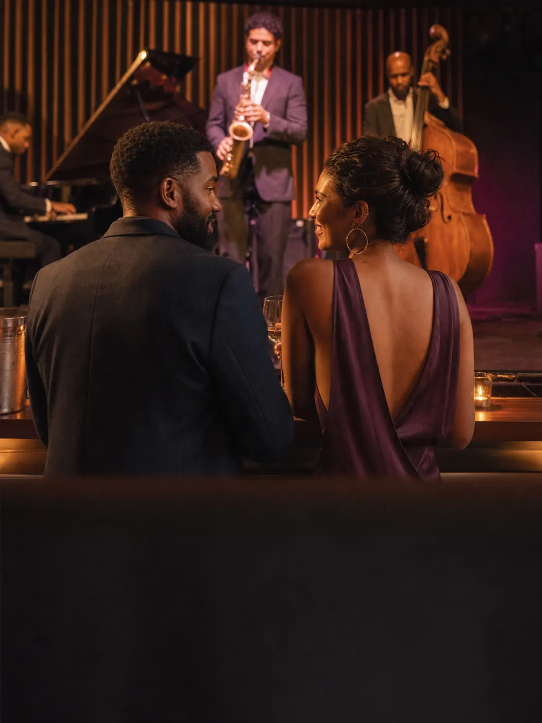 Couple enjoying live jazz at an evening music venue