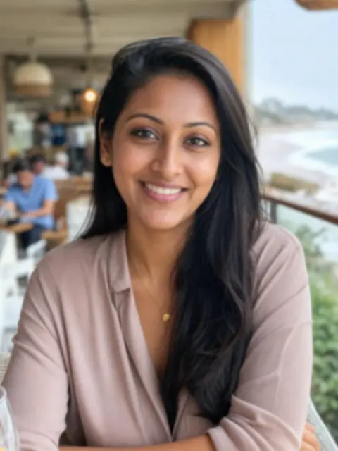 Fictional profile portrait of Priya